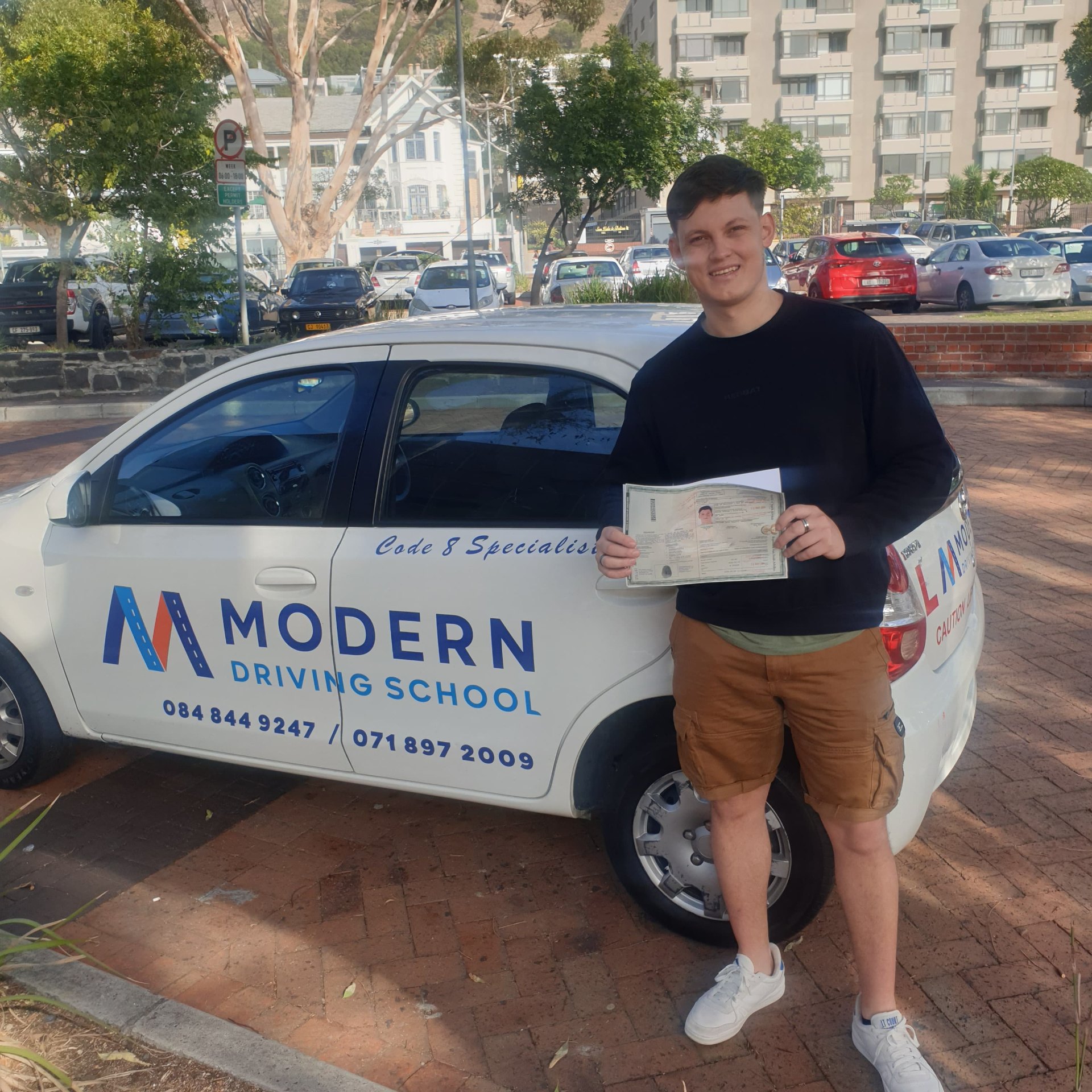 Modern Driving School student passing in a Code 8 hatchback